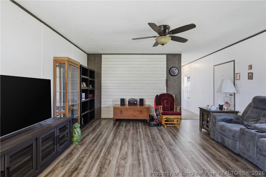 8637 Durant Nixon Road Linden, NC 28356 - Photo 4 of 36 a living room with furniture and a flat screen tv