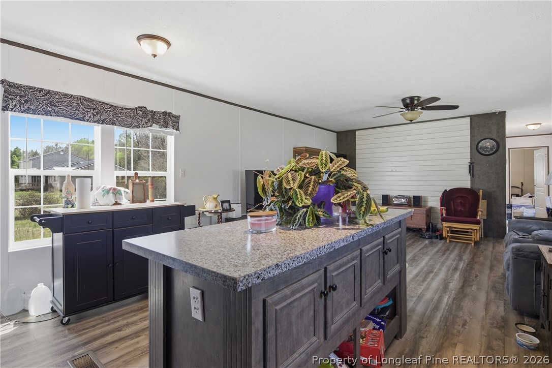 8637 Durant Nixon Road Linden, NC 28356 - Photo 6 of 36 a view of a dining room with furniture window and wooden floor