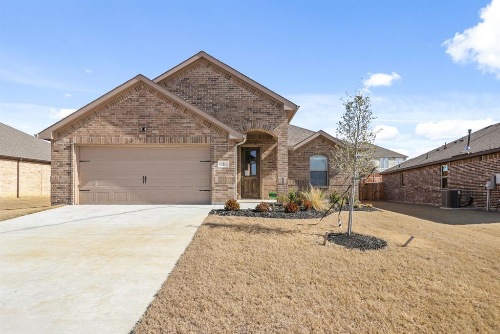 3 Mockingbird Lane Sanger, TX 76266 - Photo 1 of 1 a front view of a house with a yard