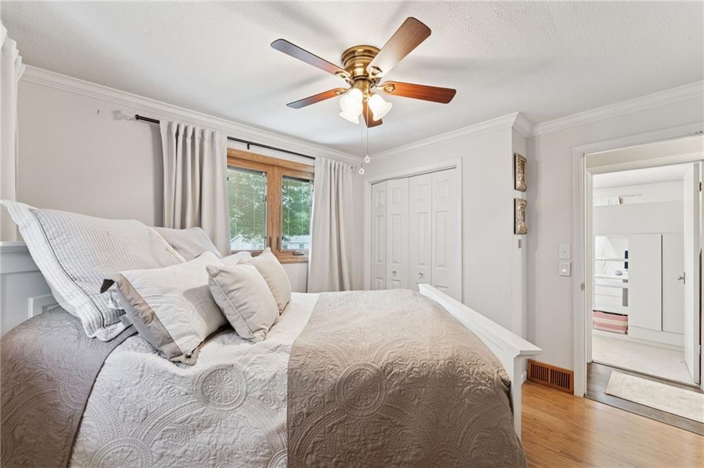 367 Brewer Road Rochester, PA 15074 - Photo 21 of 31 a bedroom with a large bed and a chandelier