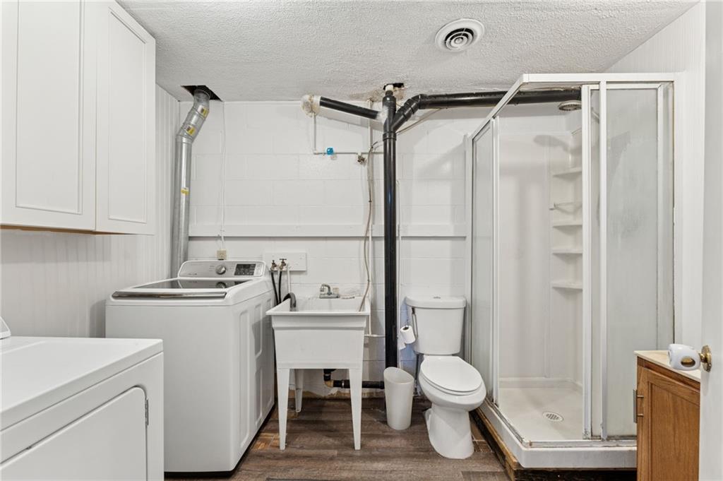 367 Brewer Road Rochester, PA 15074 - Photo 25 of 31 a bathroom with a granite countertop toilet sink and shower