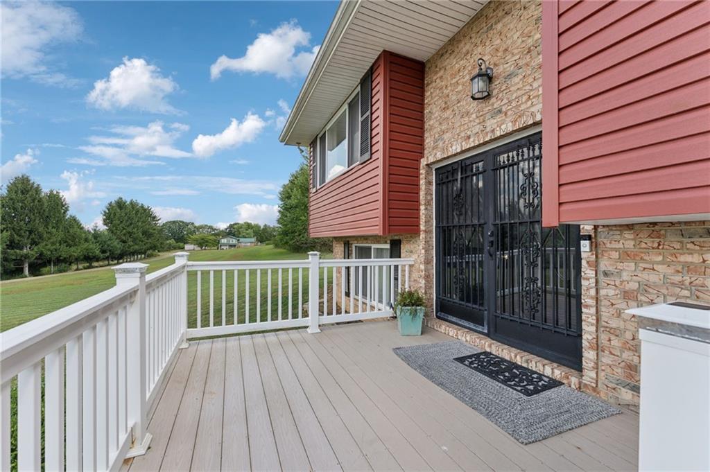 367 Brewer Road Rochester, PA 15074 - Photo 3 of 31 a view of a wooden deck and a yard