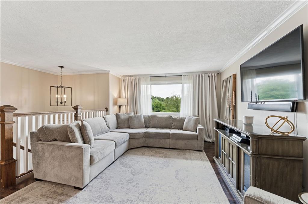 367 Brewer Road Rochester, PA 15074 - Photo 6 of 31 a living room with furniture and a flat screen tv