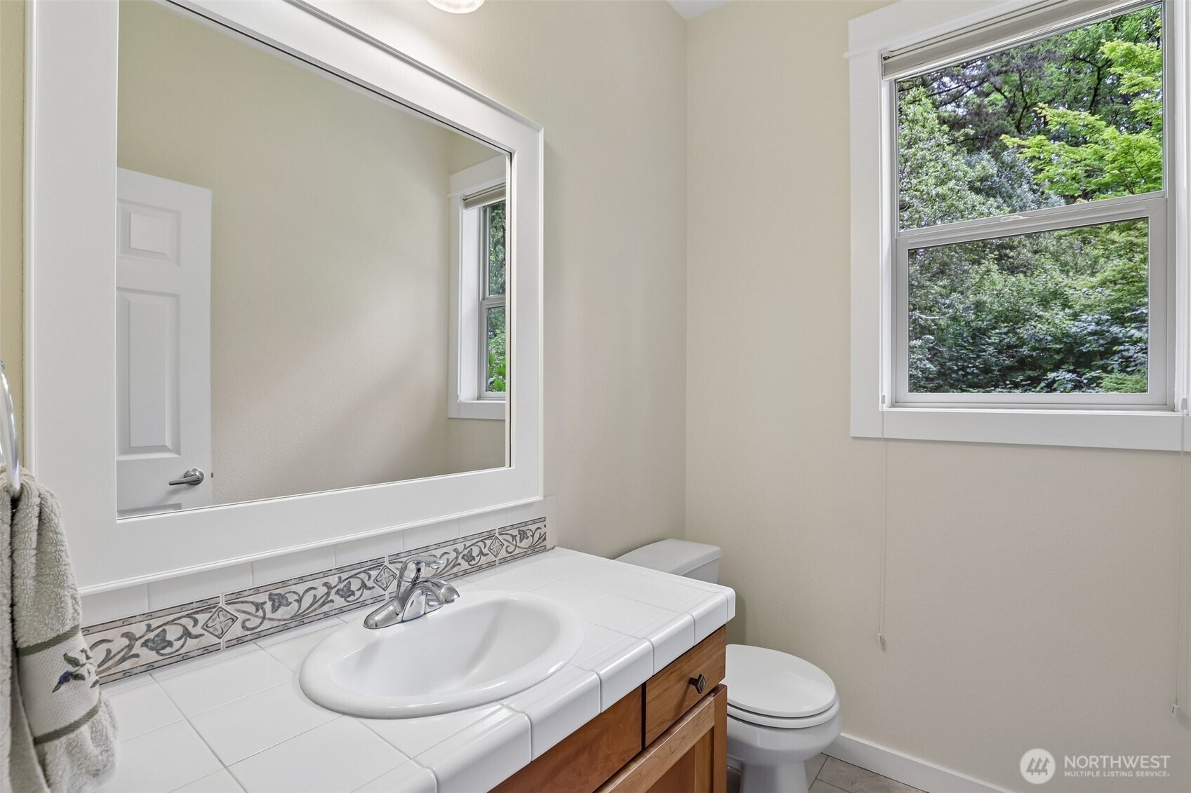 19709 Southeast 26th Way Camas, WA 98607 - Photo 32 of 36 a bathroom with a sink a toilet and a mirror