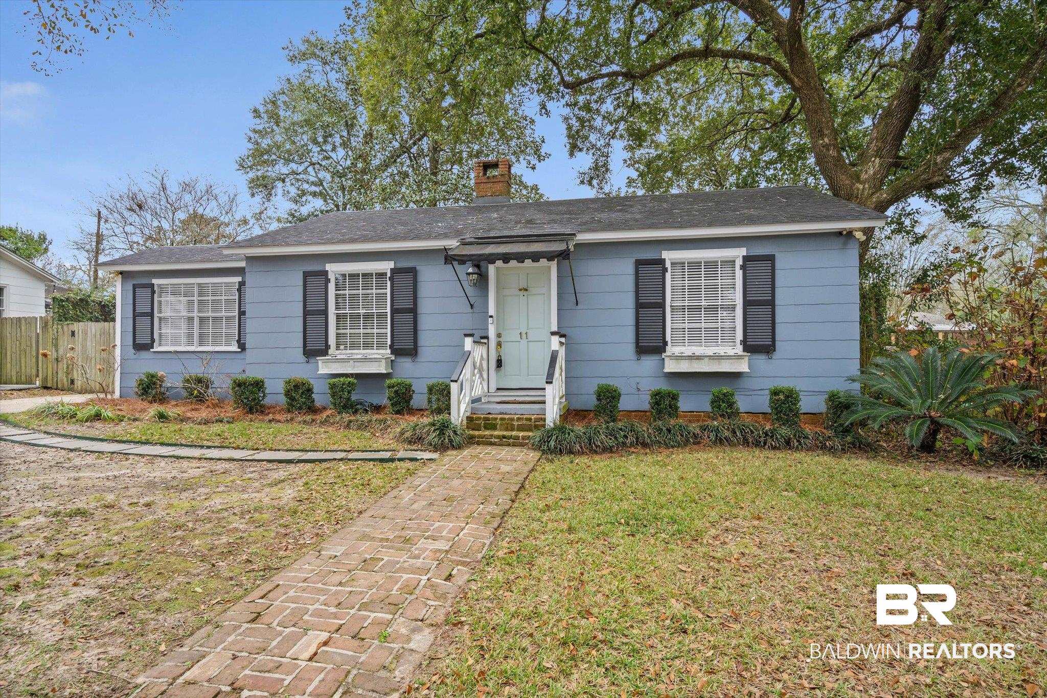 11 York Place Mobile, AL 36608 - Photo 23 of 24 Bungalow-style house featuring a chimney and roof with shingles