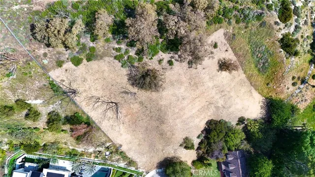 an aerial view of residential house with an outdoor space and seating