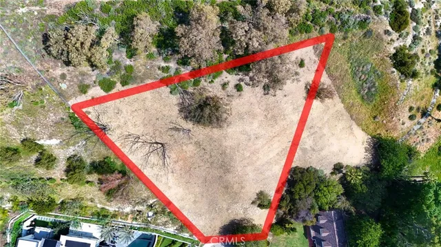 an aerial view of residential houses and city street