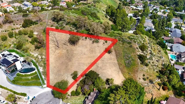 a bird view of multi story residential houses with yard