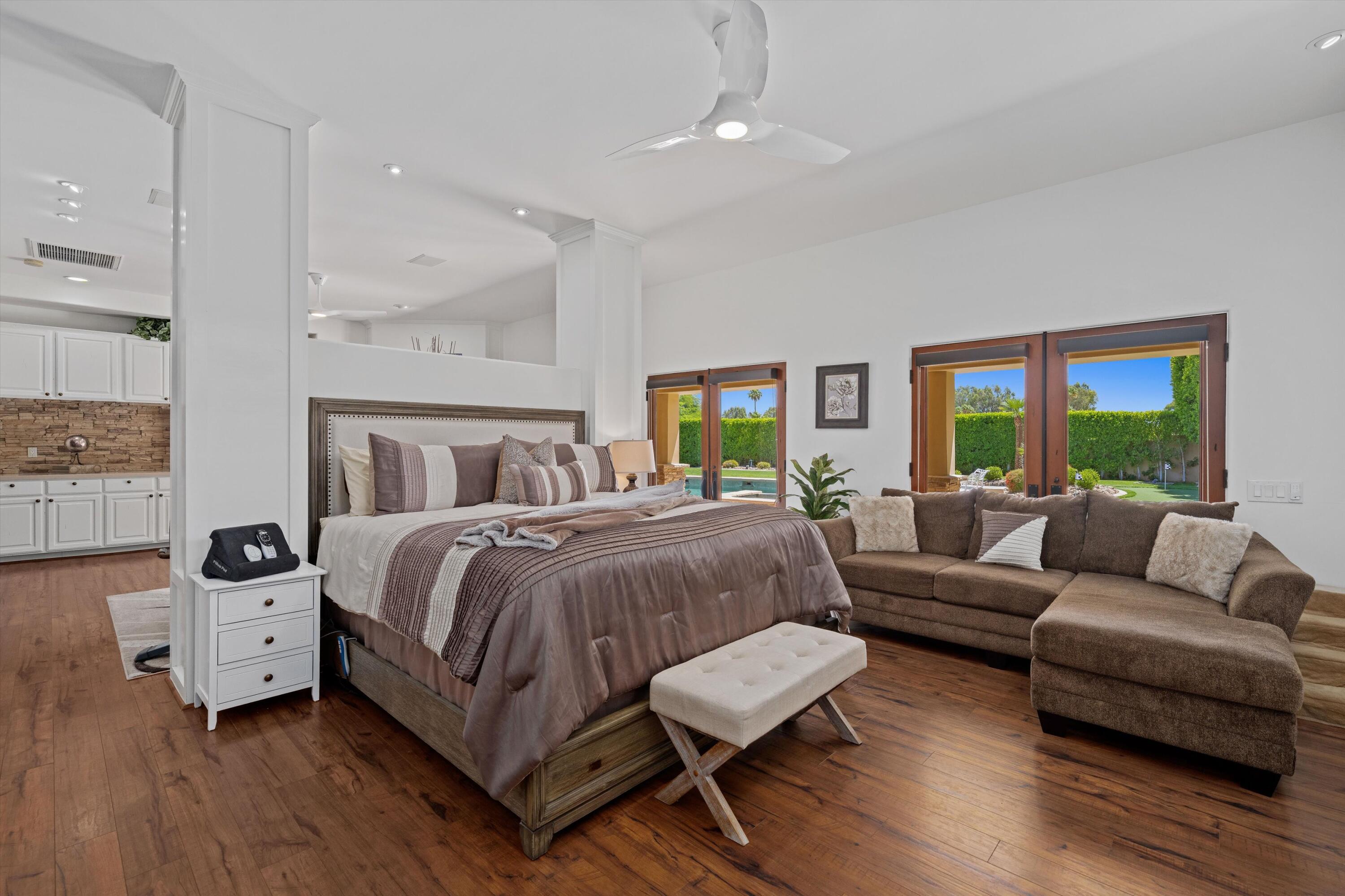 43190 Moore Circle Bermuda Dunes, CA 92203 - Photo 27 of 50 a spacious bedroom with a bed and a couch