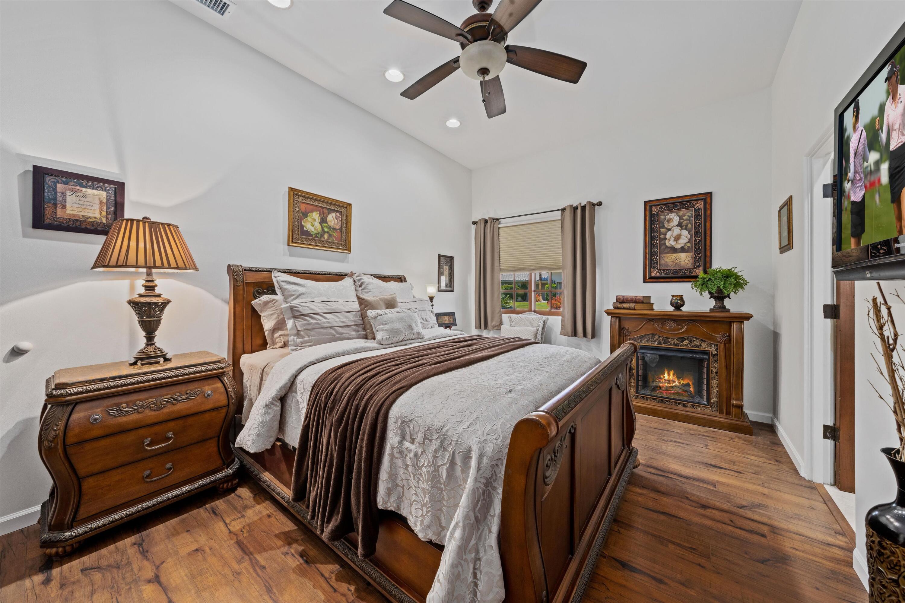 43190 Moore Circle Bermuda Dunes, CA 92203 - Photo 30 of 50 a bedroom with a bed and a chandelier