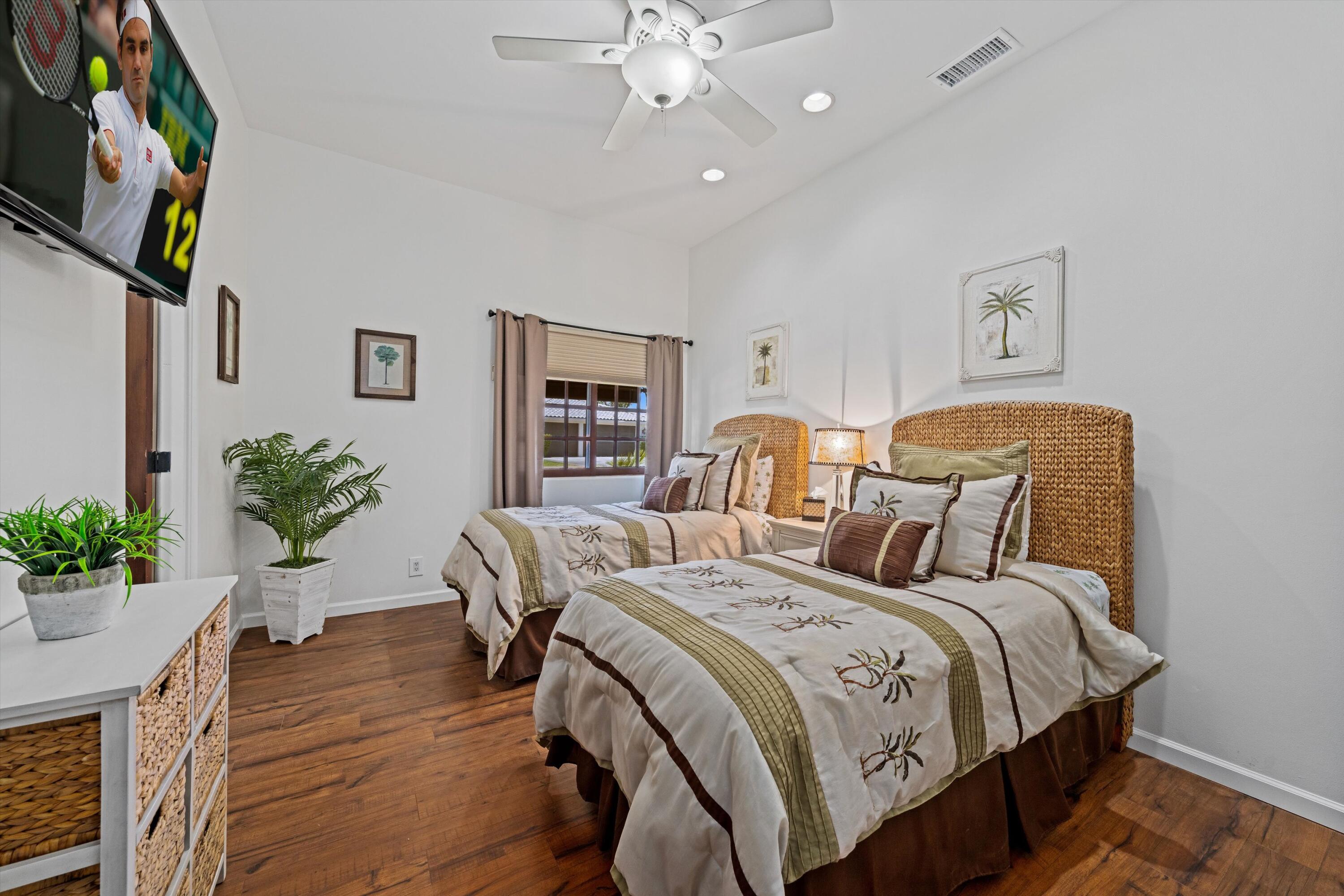 43190 Moore Circle Bermuda Dunes, CA 92203 - Photo 32 of 50 a bedroom with two beds and potted plant