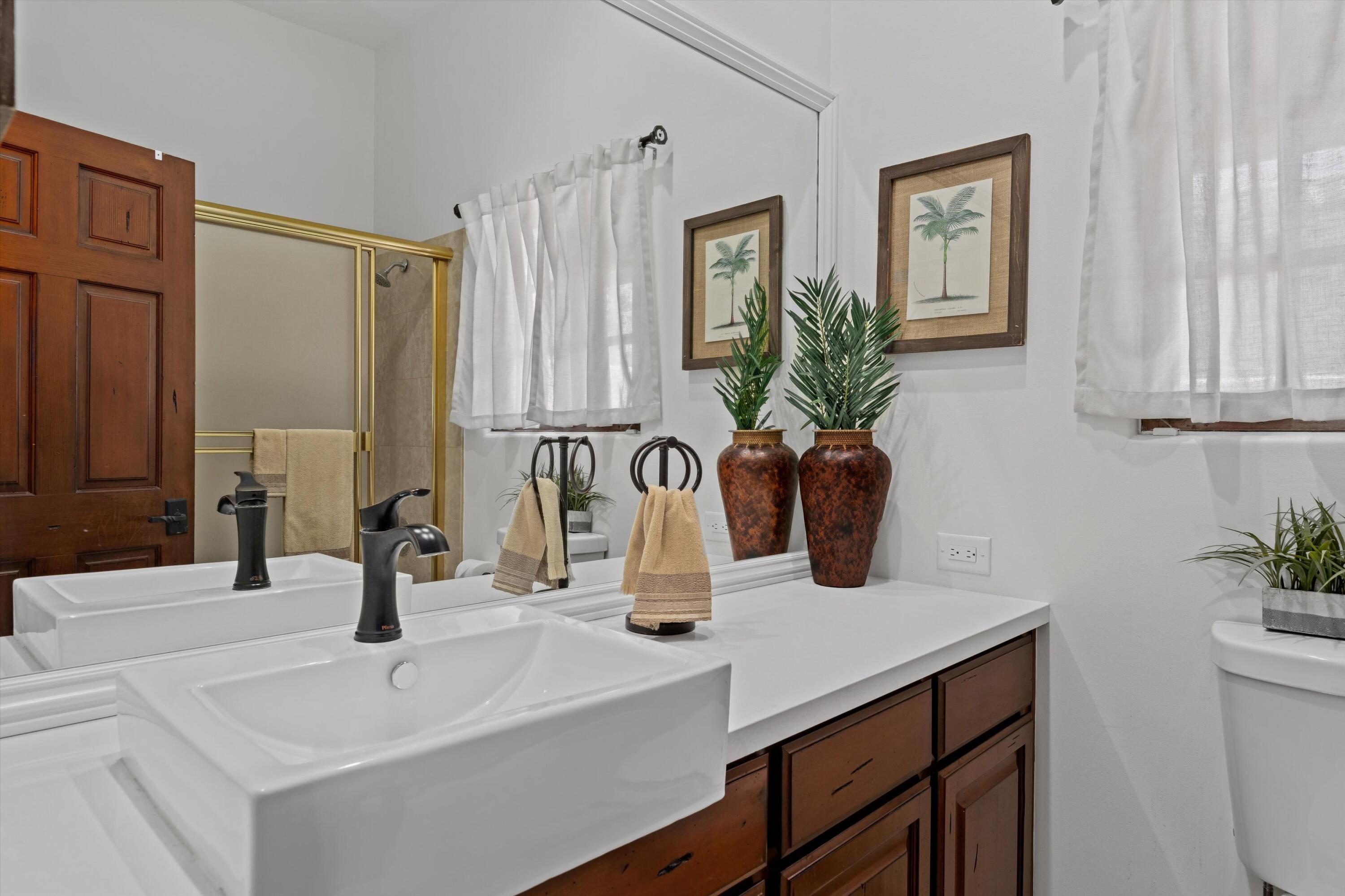43190 Moore Circle Bermuda Dunes, CA 92203 - Photo 33 of 50 a bathroom with a sink a vanity and a mirror