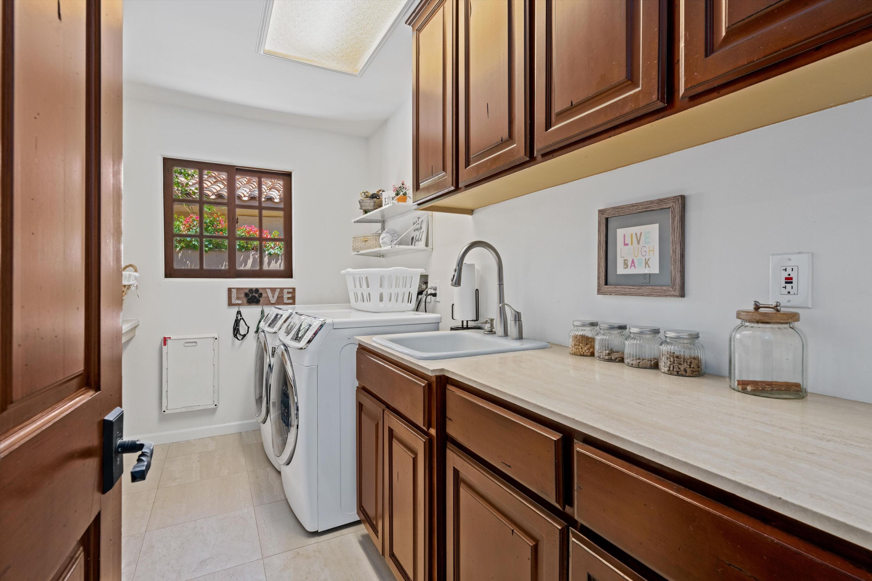 43190 Moore Circle Bermuda Dunes, CA 92203 - Photo 34 of 50 a kitchen with a sink a stove and cabinets