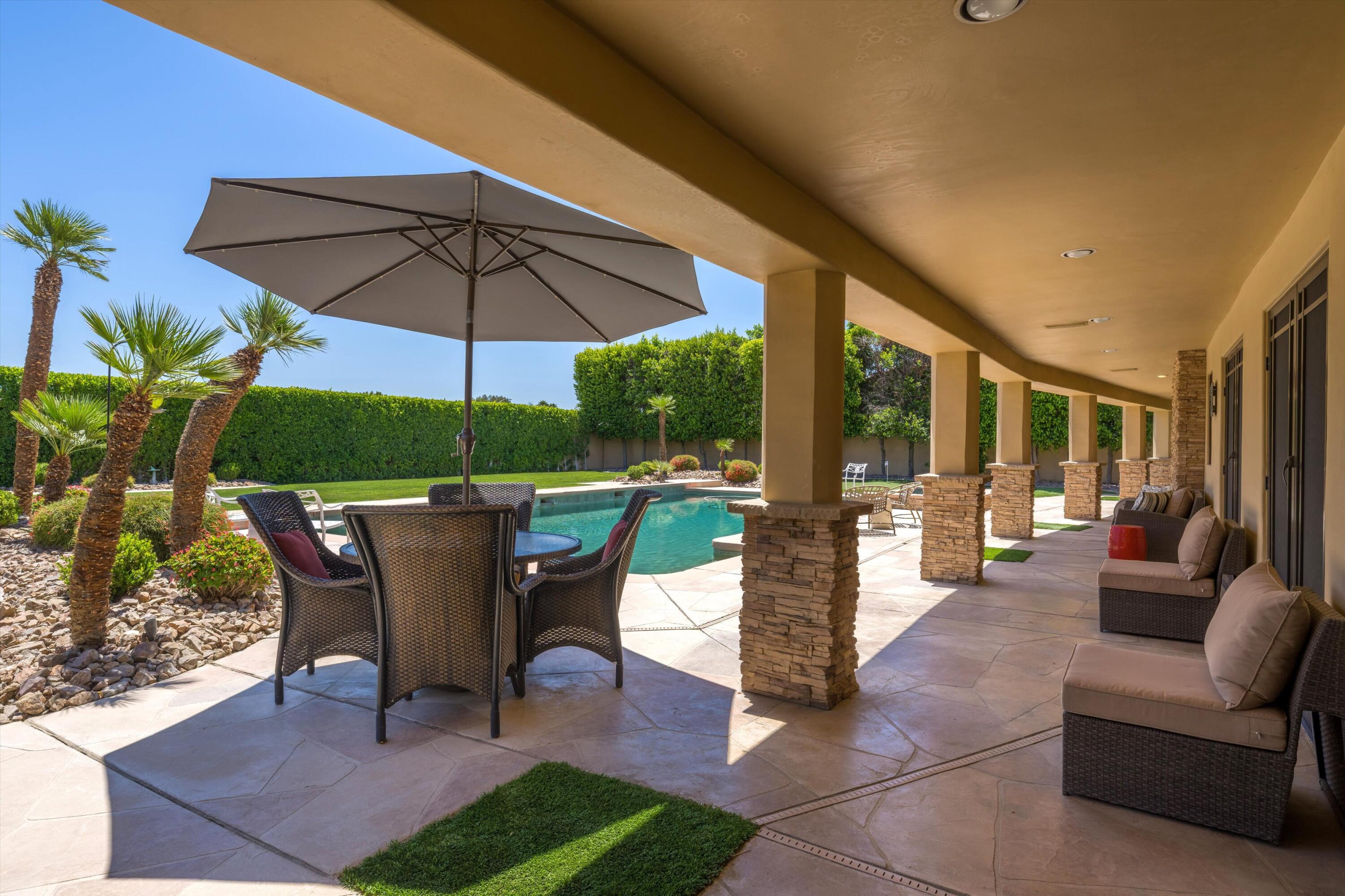 43190 Moore Circle Bermuda Dunes, CA 92203 - Photo 40 of 50 a patio with a patio table and chairs