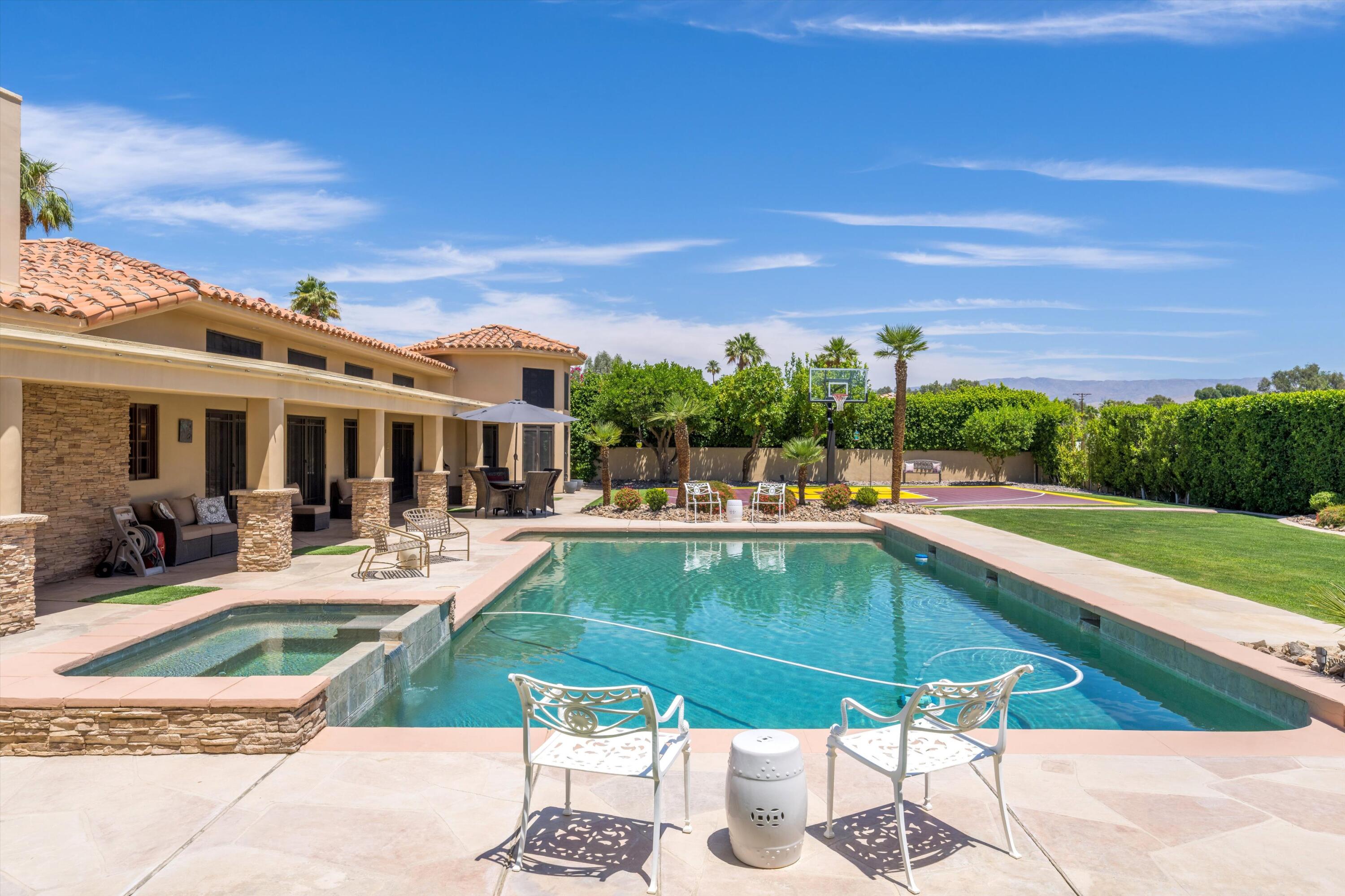 43190 Moore Circle Bermuda Dunes, CA 92203 - Photo 43 of 50 a view of a swimming pool with outdoor seating