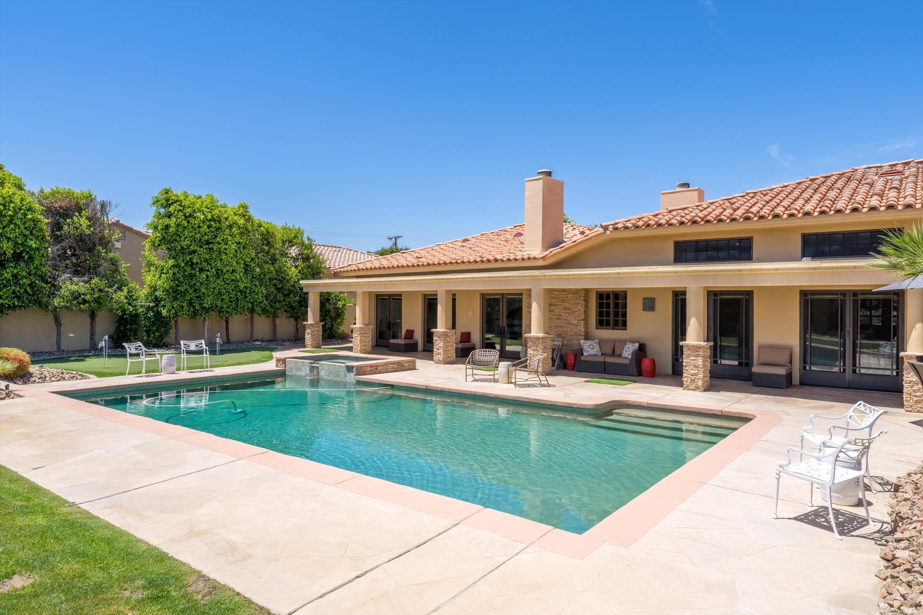 43190 Moore Circle Bermuda Dunes, CA 92203 - Photo 44 of 50 a view of a house with swimming pool and sitting area