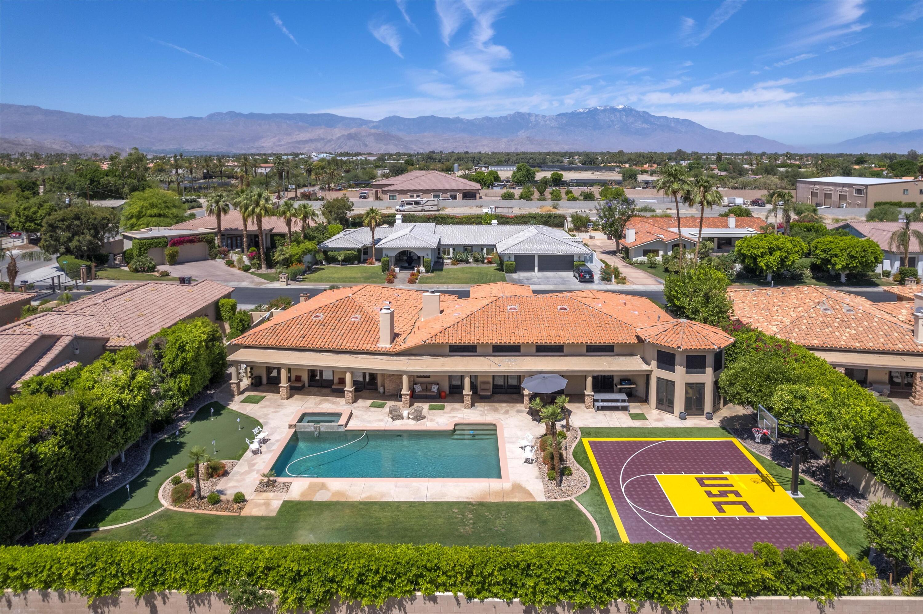 43190 Moore Circle Bermuda Dunes, CA 92203 - Photo 49 of 50 an aerial view of a house with a swimming pool yard and outdoor seating