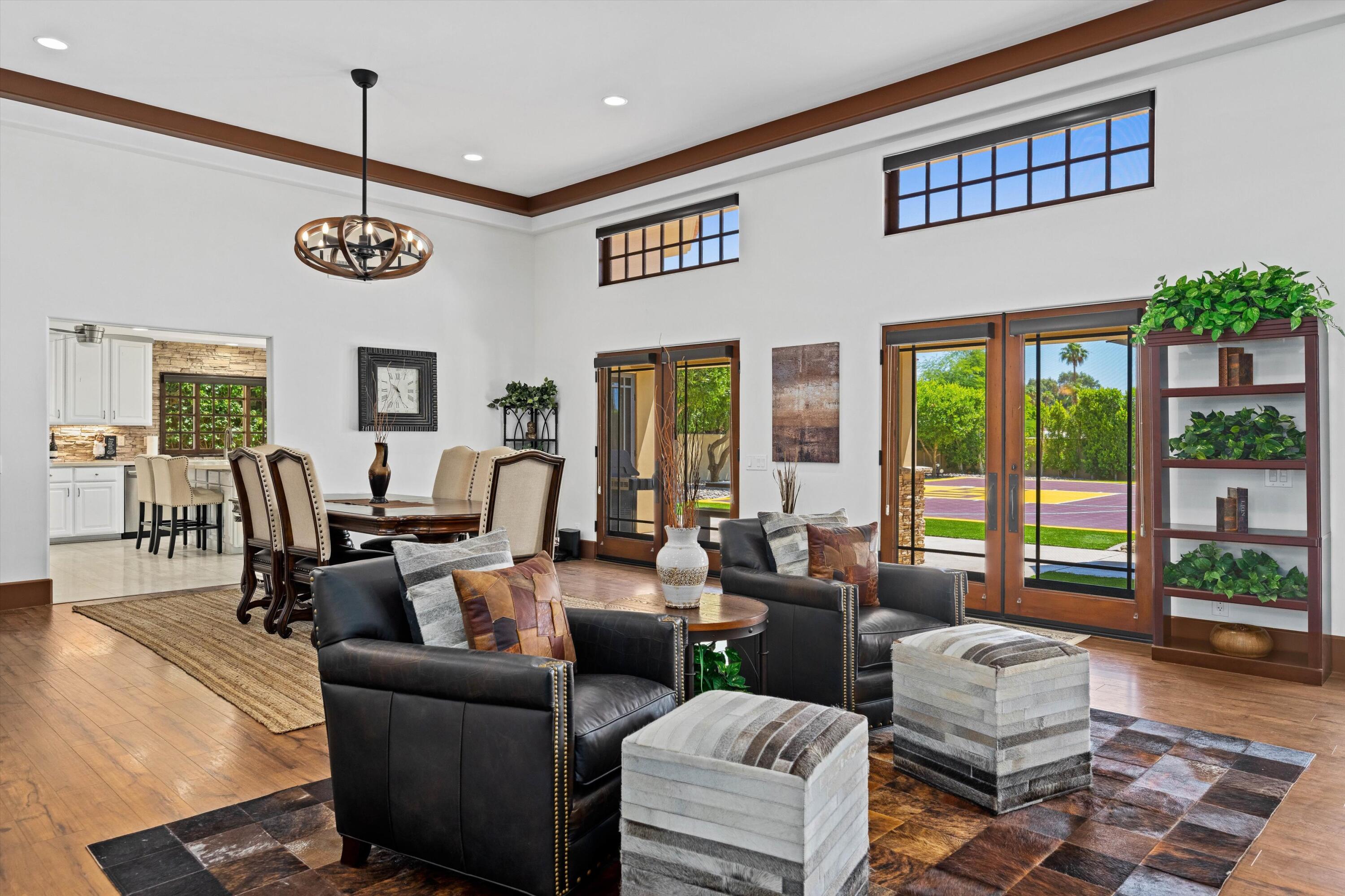 43190 Moore Circle Bermuda Dunes, CA 92203 - Photo 9 of 50 a living room with furniture and a floor to ceiling window