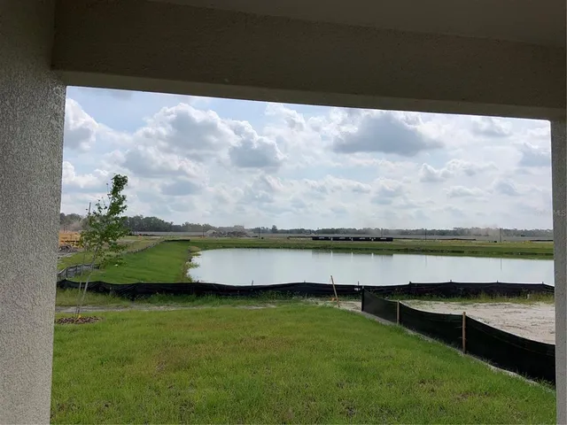 a view of swimming pool from a yard