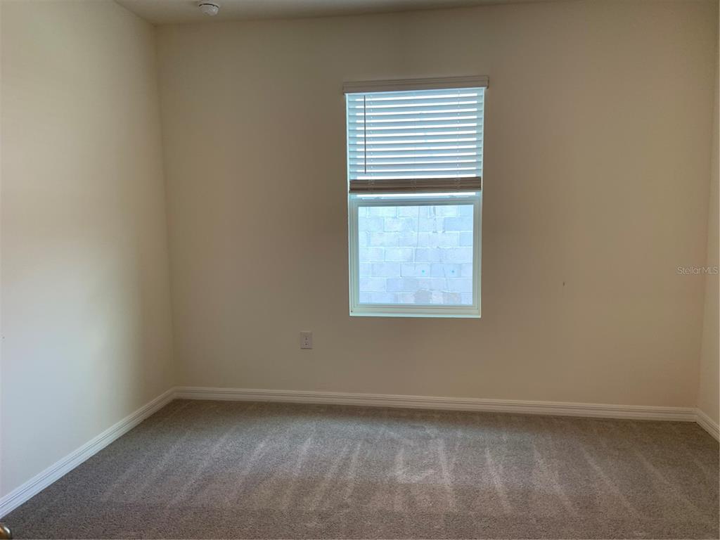 33327 Hamilton Hl Lane Wesley Chapel, FL 33545 - Photo 7 of 11 an empty room with a window