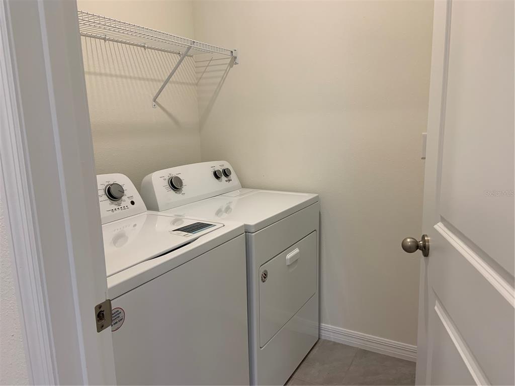 33327 Hamilton Hl Lane Wesley Chapel, FL 33545 - Photo 10 of 11 a utility room with dryer and washer