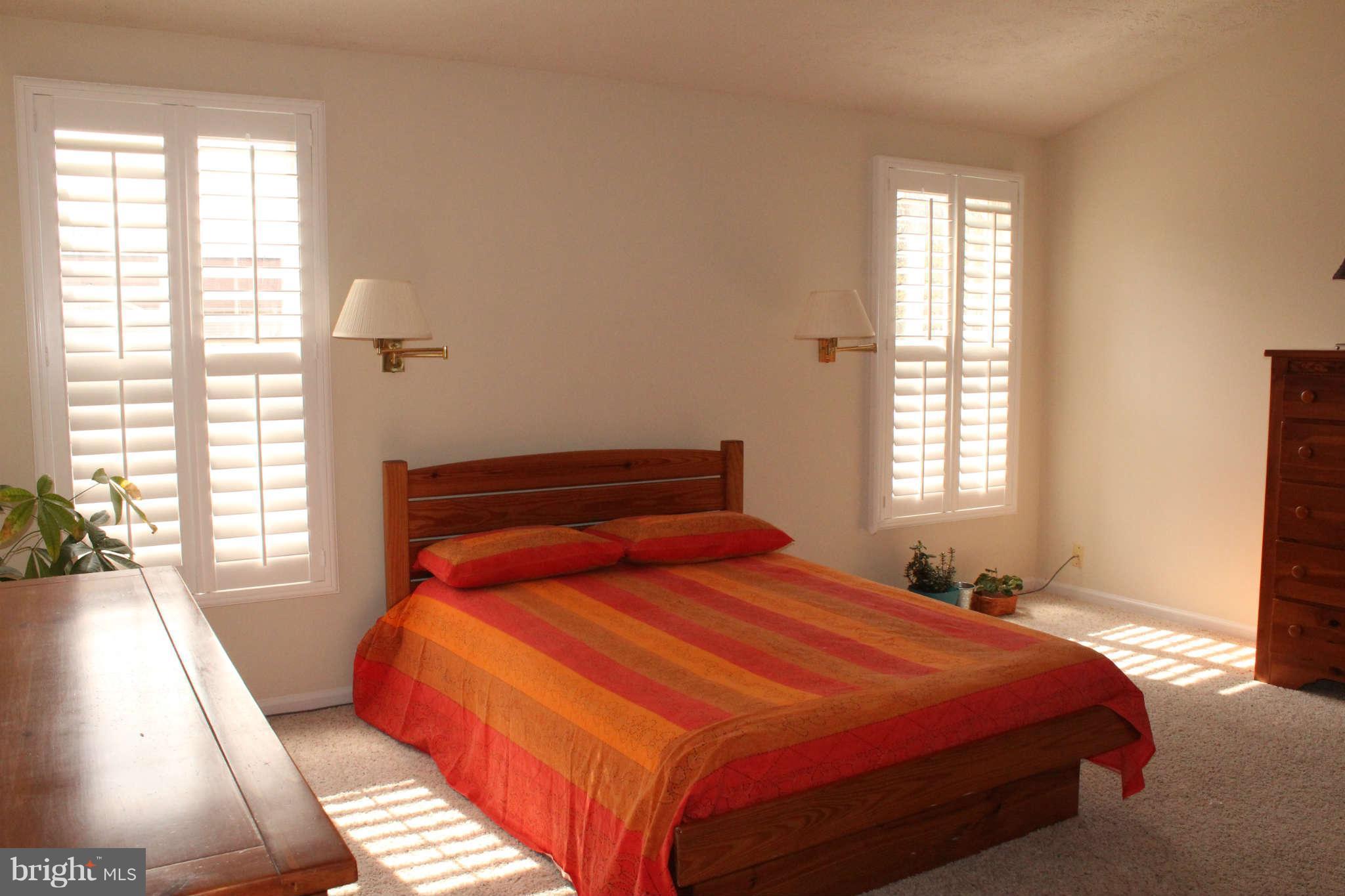 3065 Memory Lane Silver Spring, MD 20904 - Photo 12 of 29 a bedroom with a bed and wooden floor