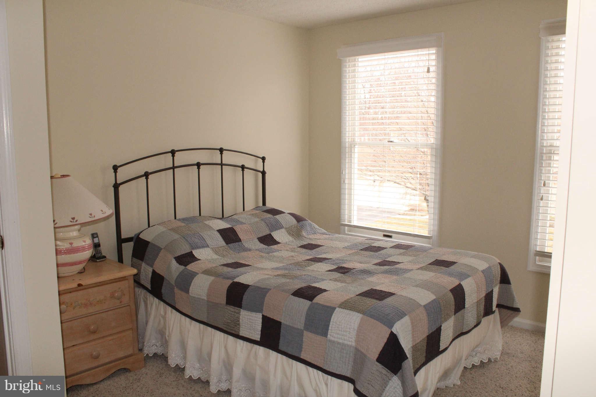 3065 Memory Lane Silver Spring, MD 20904 - Photo 20 of 29 a bedroom with a bed a window and dresser