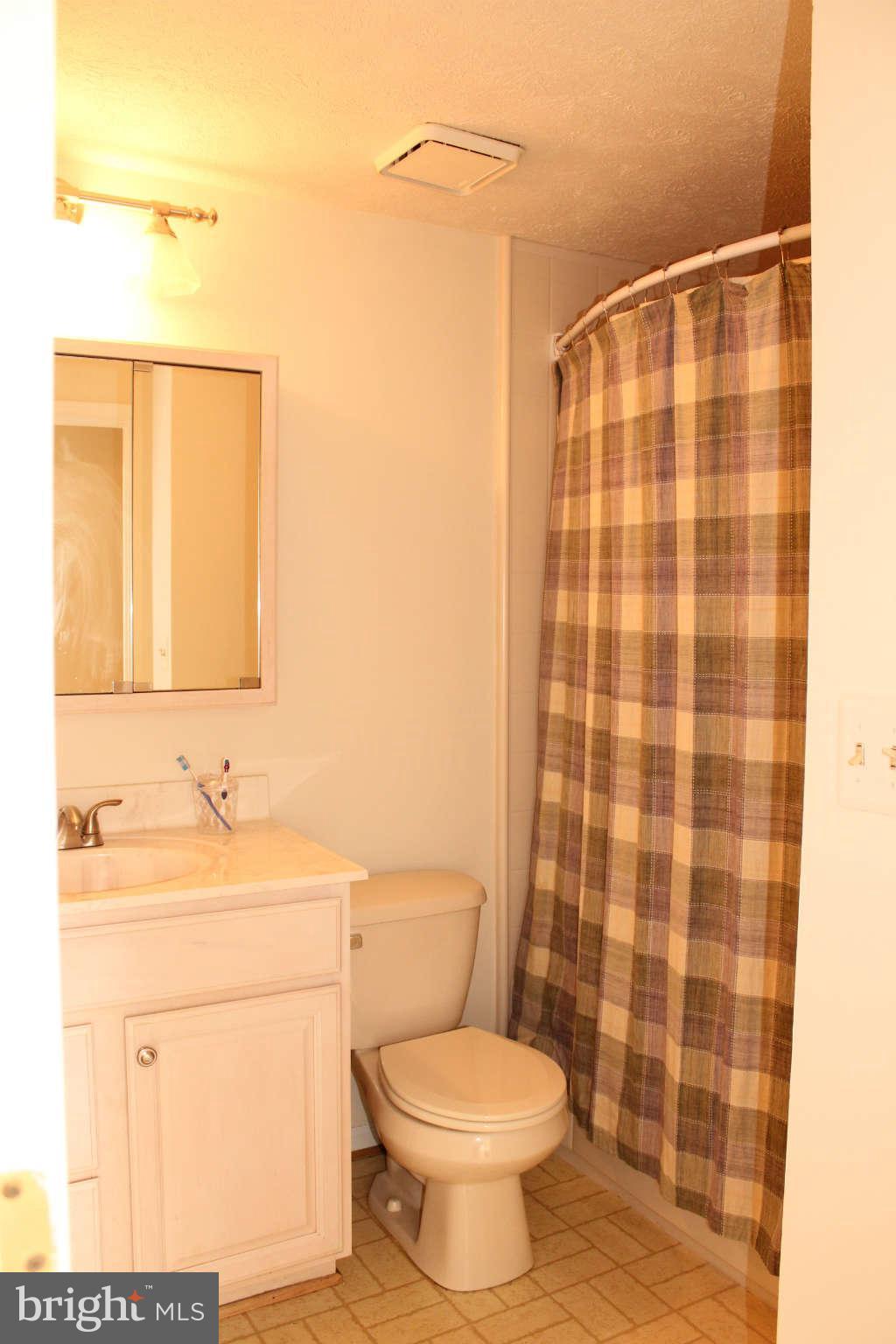 3065 Memory Lane Silver Spring, MD 20904 - Photo 22 of 29 a bathroom with a sink toilet and shower