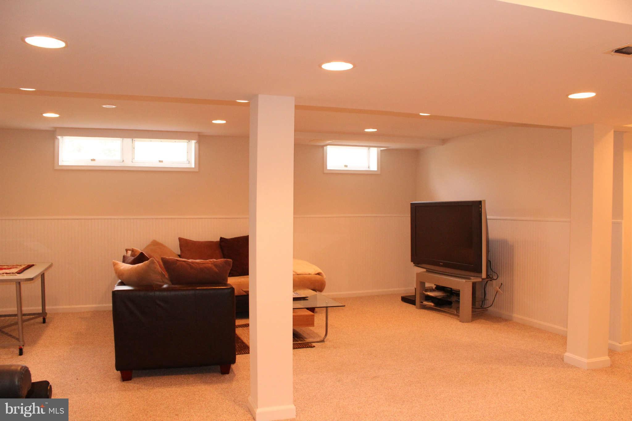 3065 Memory Lane Silver Spring, MD 20904 - Photo 23 of 29 a room with furniture and a flat screen tv