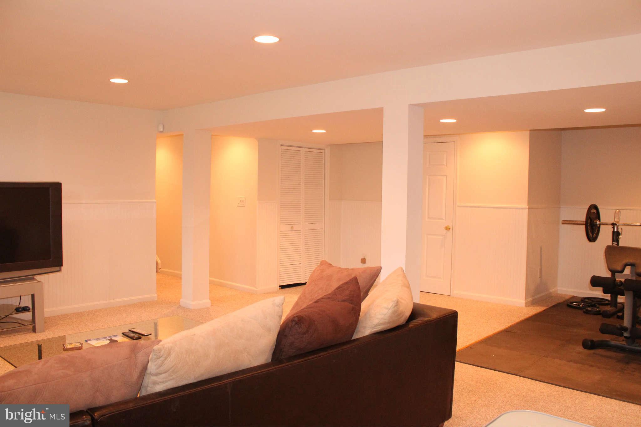 3065 Memory Lane Silver Spring, MD 20904 - Photo 24 of 29 a living room with furniture and a flat screen tv