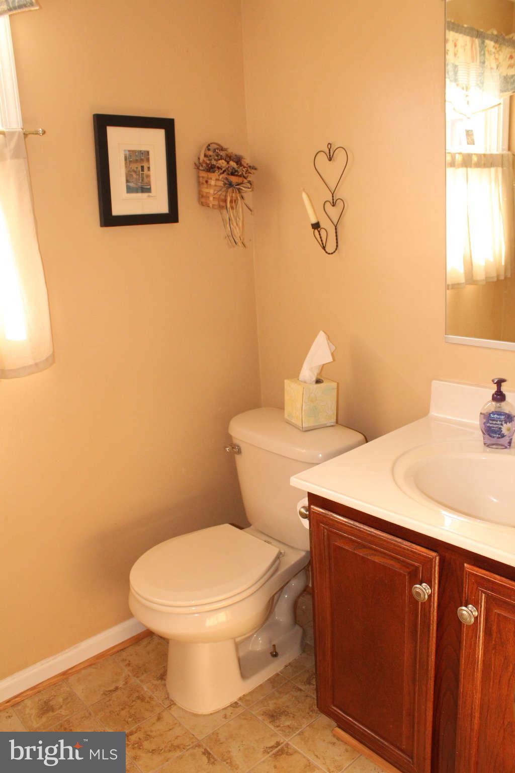 3065 Memory Lane Silver Spring, MD 20904 - Photo 25 of 29 a bathroom with a toilet sink and vanity
