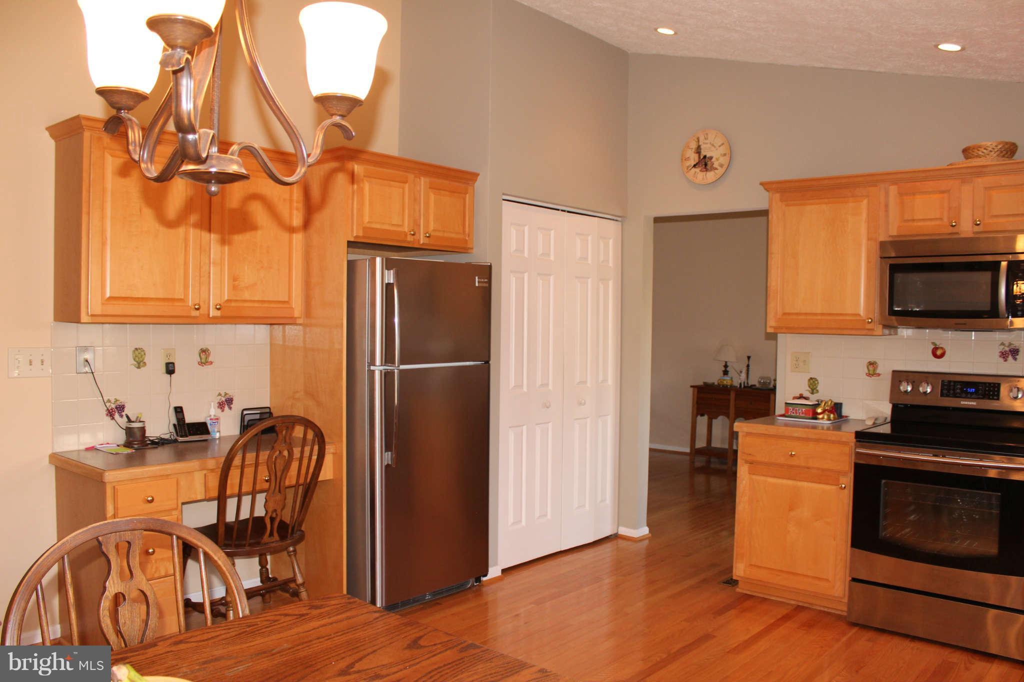 3065 Memory Lane Silver Spring, MD 20904 - Photo 8 of 29 a kitchen with stainless steel appliances granite countertop a refrigerator and a stove top oven