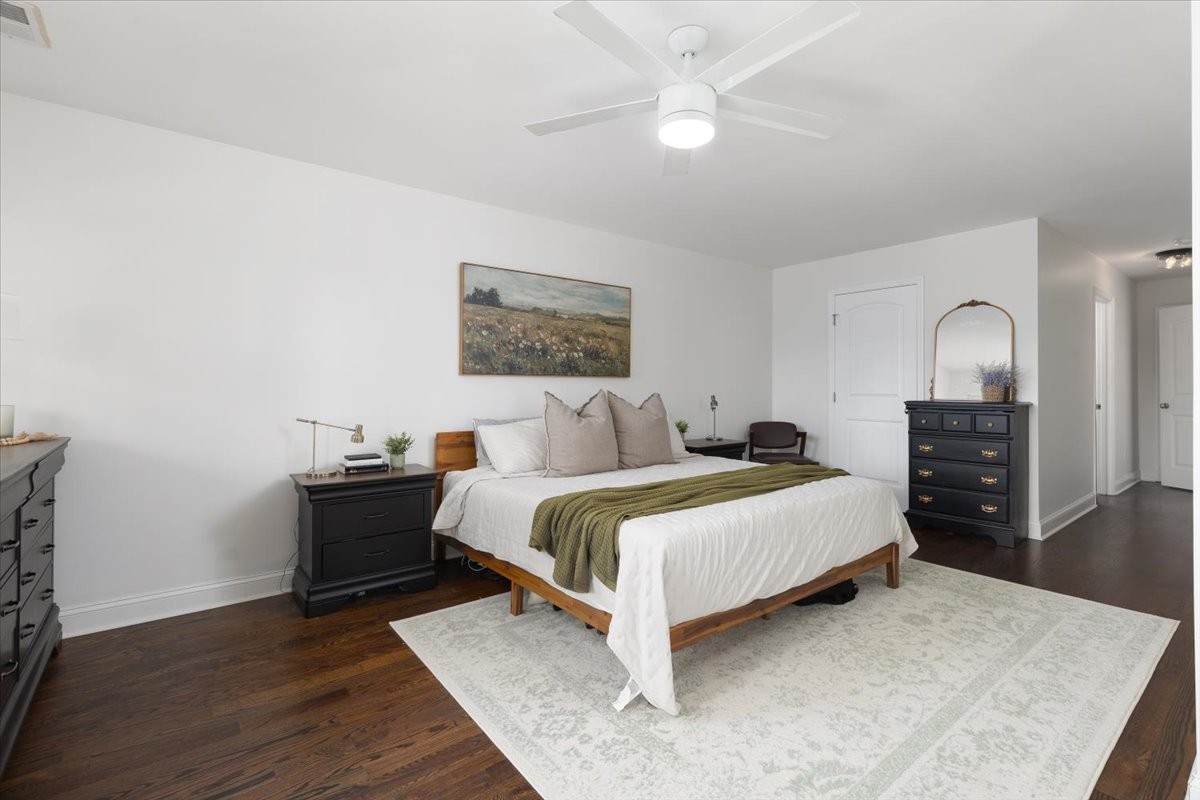 175 B Rural Avenue Nashville, TN 37209 - Photo 15 of 26 a spacious bedroom with a bed and a chandelier