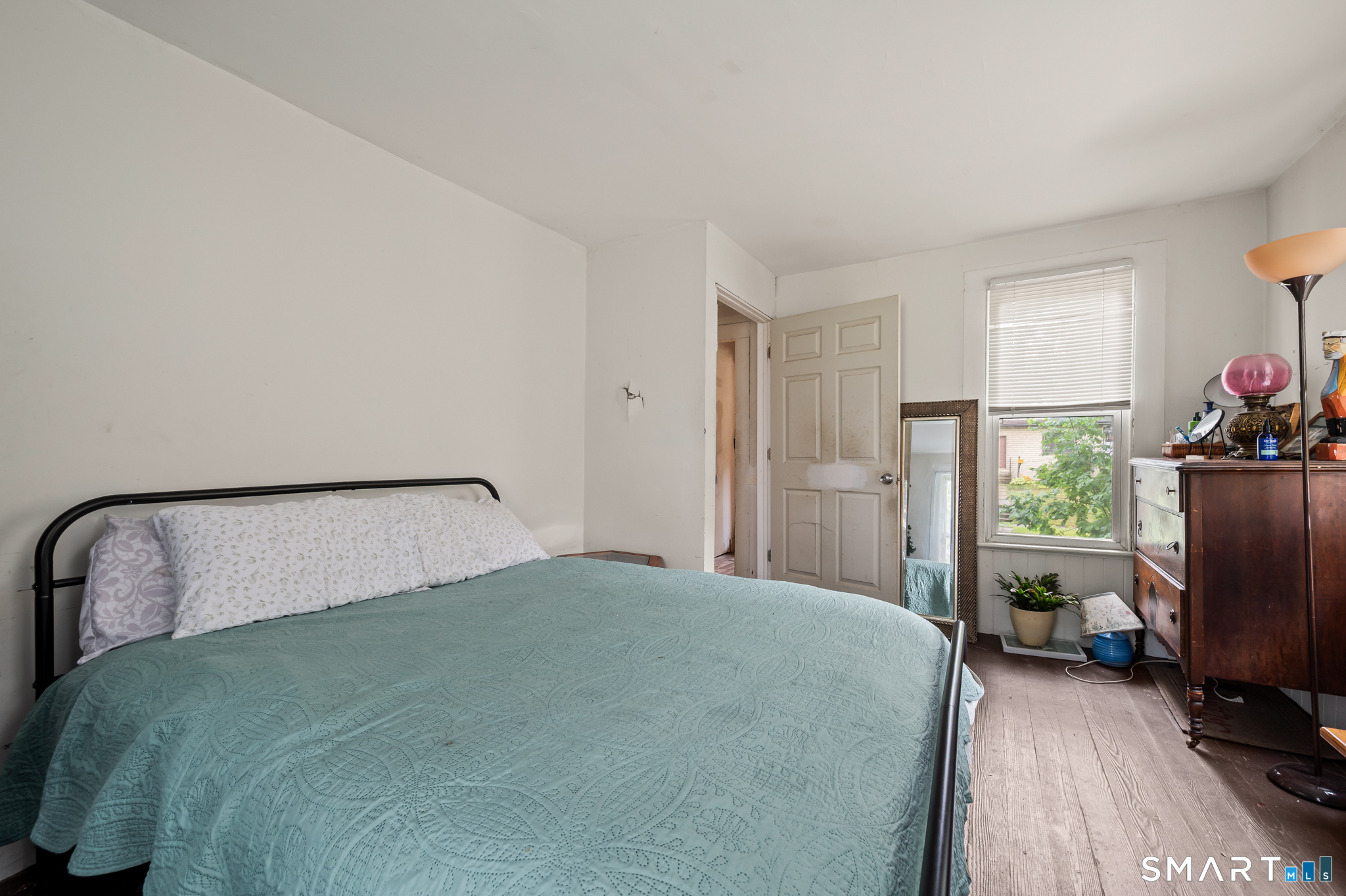 220 Murray Street Meriden, CT 06450 - Photo 20 of 28 a bedroom with a bed chair and a large window