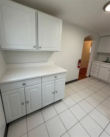 a kitchen with a cabinets and white appliances