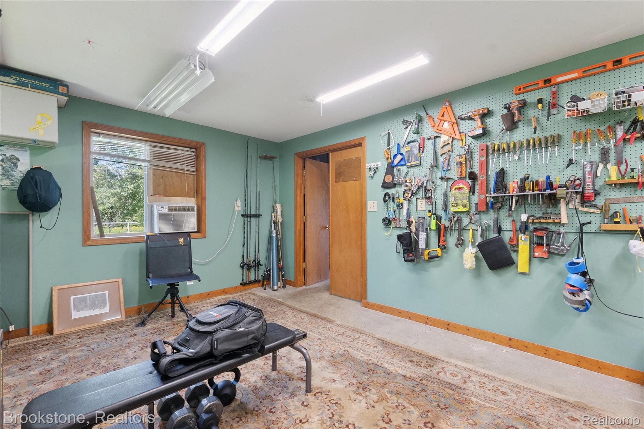 13962 South Beardslee Road Perry, MI 48872 - Photo 53 of 56 Workout area featuring baseboards and a workshop area