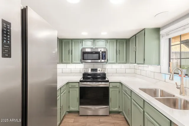 a kitchen with a stove and a sink