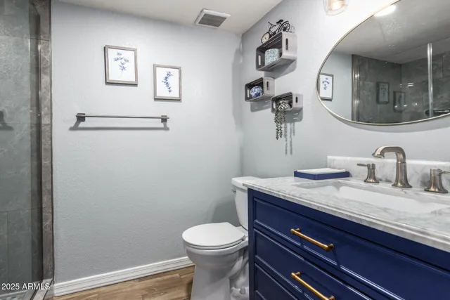 a bedroom with a bed and flat screen tv