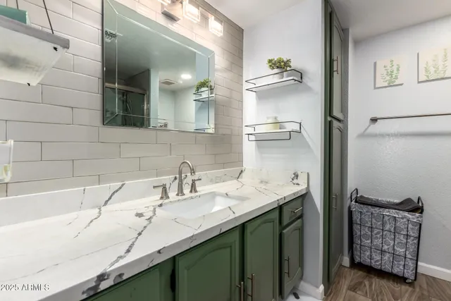 a bathroom with a sink and a mirror
