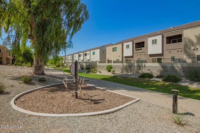 a view of yard with swimming pool and trees