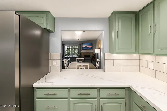 a kitchen with a sink and a large window