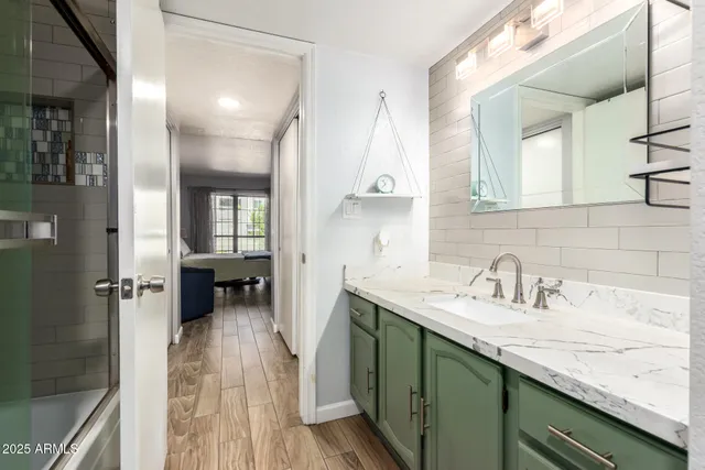 a bathroom with a sink and a mirror