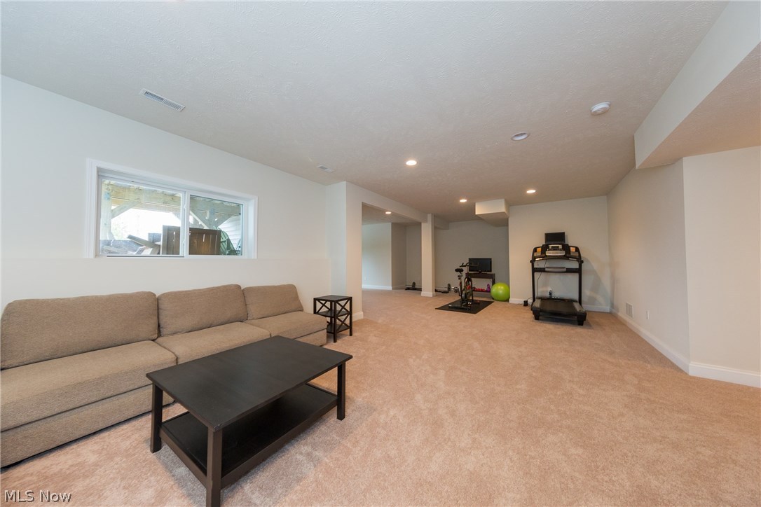 7420 Mystic Ridge Road Chagrin Falls, OH 44023 - Photo 27 of 35 950 square feet of carpeted lower level. Plenty of space to add a kitchen and bedroom. Voila...in-law OR teen suite!!