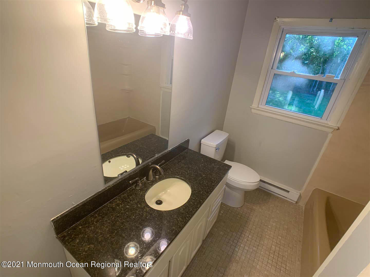 109 Beverly Drive Barnegat, NJ 08005 - Photo 12 of 20 a bathroom with a granite countertop sink and a mirror