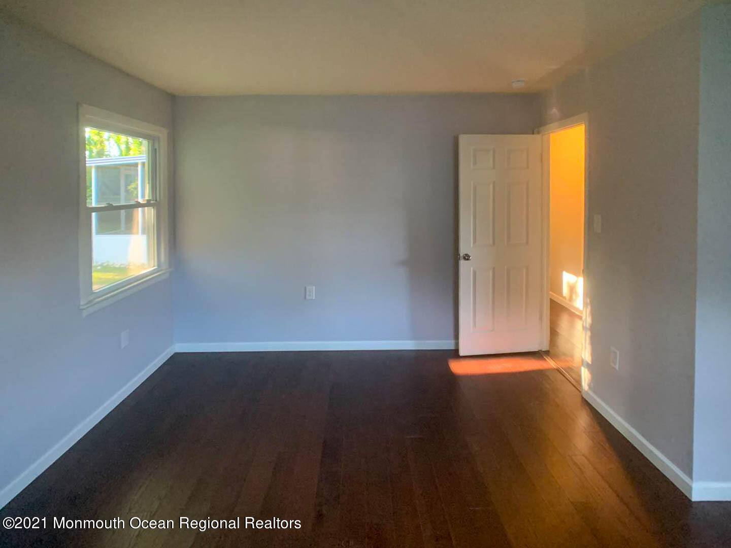 109 Beverly Drive Barnegat, NJ 08005 - Photo 16 of 20 an empty room with wooden floor and windows