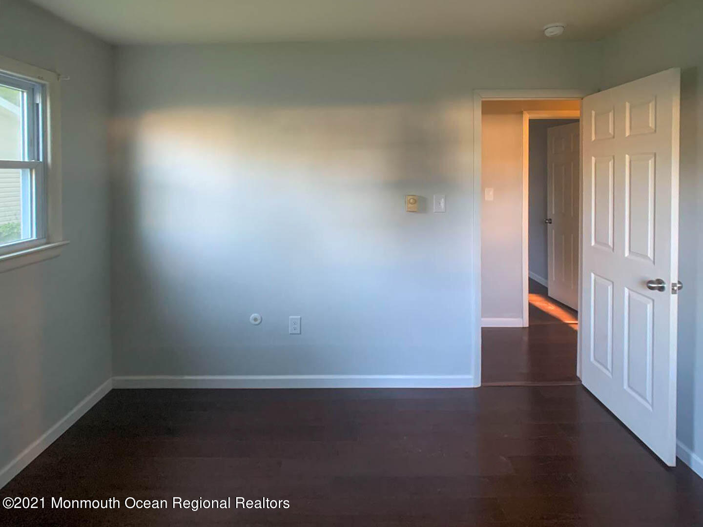 109 Beverly Drive Barnegat, NJ 08005 - Photo 20 of 20 an empty room with wooden floor and windows