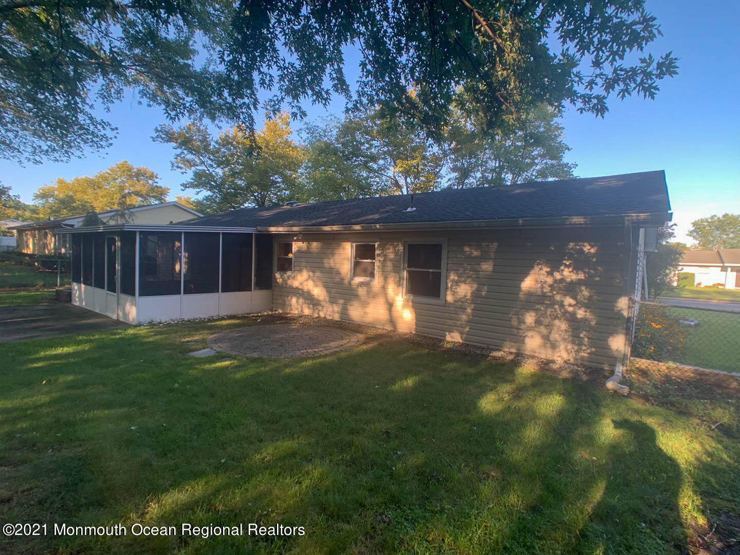 109 Beverly Drive Barnegat, NJ 08005 - Photo 3 of 20 a backyard of a house with table and chairs