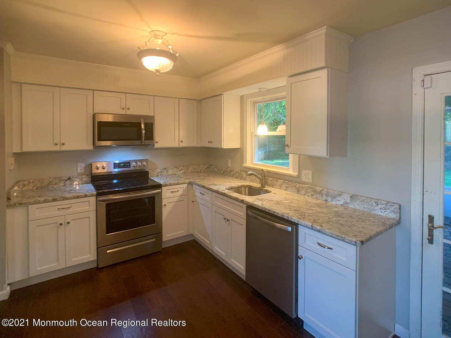 109 Beverly Drive Barnegat, NJ 08005 - Photo 9 of 20 a kitchen with granite countertop a stove and a sink