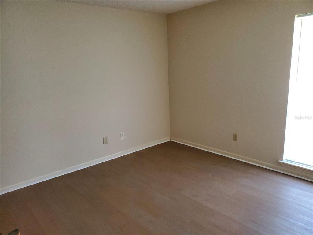 5375 Southeast 29th Place, Unit B Ocala, FL 34480 - Photo 5 of 11 an empty room with a window