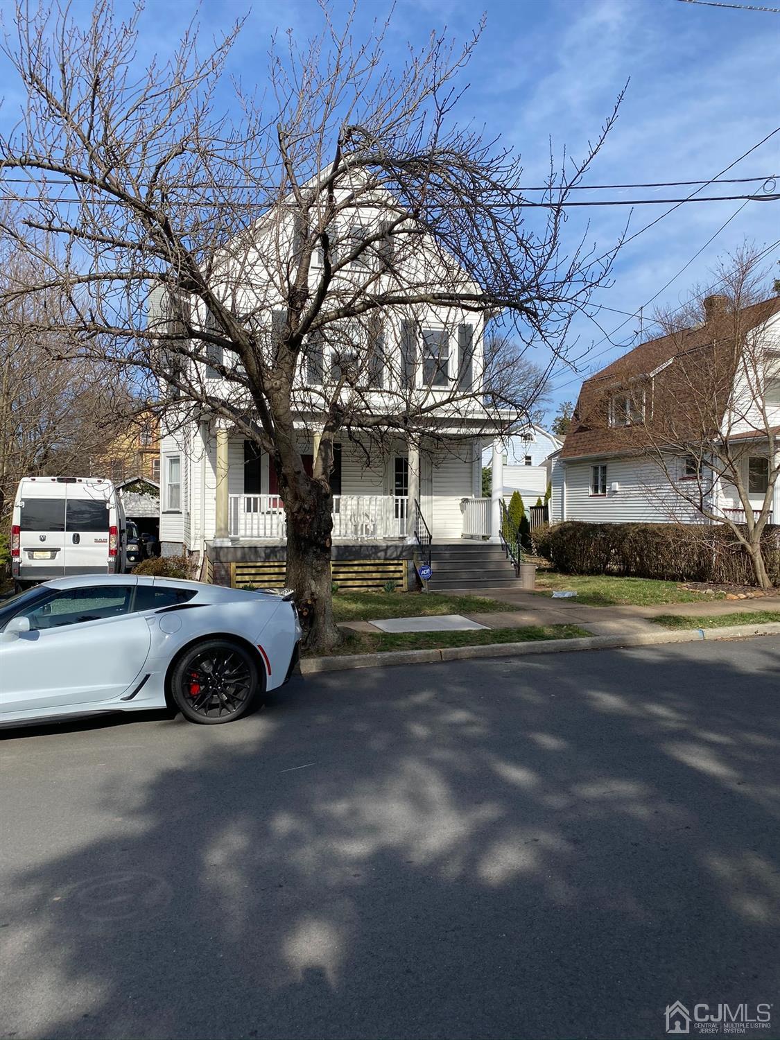 a view of a car in front of a house